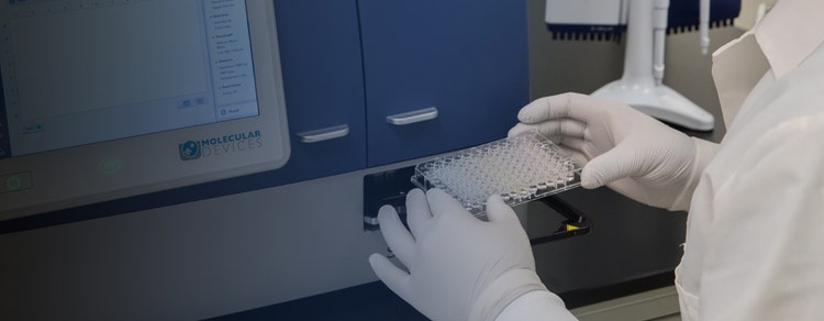 Scientist working on Multi-Mode Reader